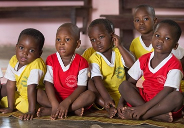 Children listen to a vocabulary lesson at the Bethlehem Day Care Center in Youhoulil, Côte d'Ivoire. The United Methodist Women’s organization in the Dabou District started the program in 2016 to help provide nutrition and education for the children of local farmers. Children listen to a vocabulary lesson at the Bethlehem Day Care Center in Youhoulil, Côte d'Ivoire. The United Methodist Women’s organization in the Dabou District started the program in 2016 to help provide nutrition and education for the children of local farmers.