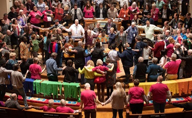 Attendees and guests of the Reconciling Ministries Network convocation pray together at the altar at Belmont United Methodist Church in Nashville, Tenn. LGBTQ United Methodists and their allies expressed hope that a proposal to separate the denomination might pave the way to end what they see as discrimination. Photo by Mike DuBose, UM News. Attendees and guests of the Reconciling Ministries Network convocation pray together at the altar at Belmont United Methodist Church in Nashville, Tenn. LGBTQ United Methodists and their allies expressed hope that a proposal to separate the denomination might pave the way to end what they see as discrimination. Photo by Mike DuBose, UM News.
