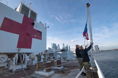 Sailors on the hospital ship USNS Comfort raise the colors while the ship is moored in New York Harbor in support of the nation’s COVID-19 response efforts. United Methodist leaders are painting a sobering picture of the coronavirus impact on New York and New Jersey. “This is our new 9/11 in New York,” said New York Area Bishop Thomas J. Bickerton. Photo by Mass Communication Specialist 2nd Class Sara Eshleman, U.S. Navy. Sailors on the hospital ship USNS Comfort raise the colors while the ship is moored in New York Harbor in support of the nation’s COVID-19 response efforts. United Methodist leaders are painting a sobering picture of the coronavirus impact on New York and New Jersey. “This is our new 9/11 in New York,” said New York Area Bishop Thomas J. Bickerton. Photo by Mass Communication Specialist 2nd Class Sara Eshleman, U.S. Navy.