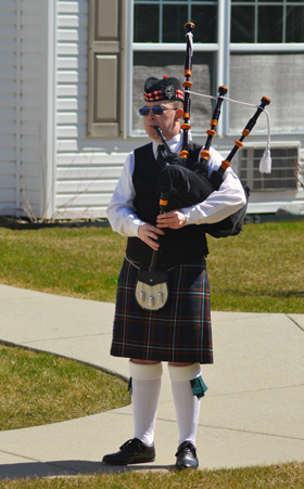 Wyatt Clarke, in full regalia, plays bagpipes around his Marysville, Michigan, neighborhood for residents either shut-in or self-isolating during the COVID-19 pandemic. Photo courtesy of Marysville United Methodist Church.