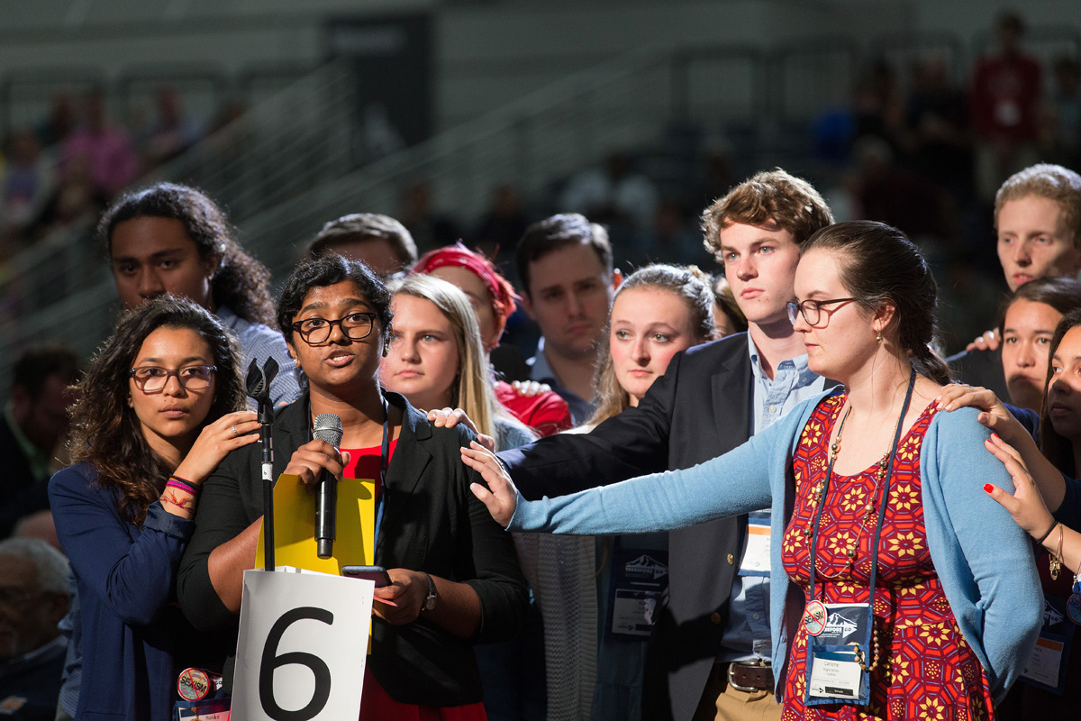 Ann Jacob of the Eastern Pennsylvania Conference is surrounded by other young people as she reads a statement on church unity at the 2016 United Methodist General Conference in Portland, Ore. She is among authors of a petition urging General Conference organizers to reconsider rescheduling General Conference at the start of the academic calendar. File photo by Mike DuBose, UM News. Ann Jacob of the Eastern Pennsylvania Conference is surrounded by other young people as she reads a statement on church unity at the 2016 United Methodist General Conference in Portland, Ore. She is among authors of a petition urging General Conference organizers to reconsider rescheduling General Conference at the start of the academic calendar. File photo by Mike DuBose, UM News.