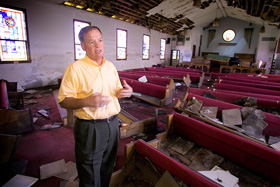 The Rev. Irvin Boudreaux discusses recovery efforts at Brooks United Methodist Church in New Orleans in 2006 nearly a year after Hurricane Katrina. File photo by Mike DuBose, UMNS.