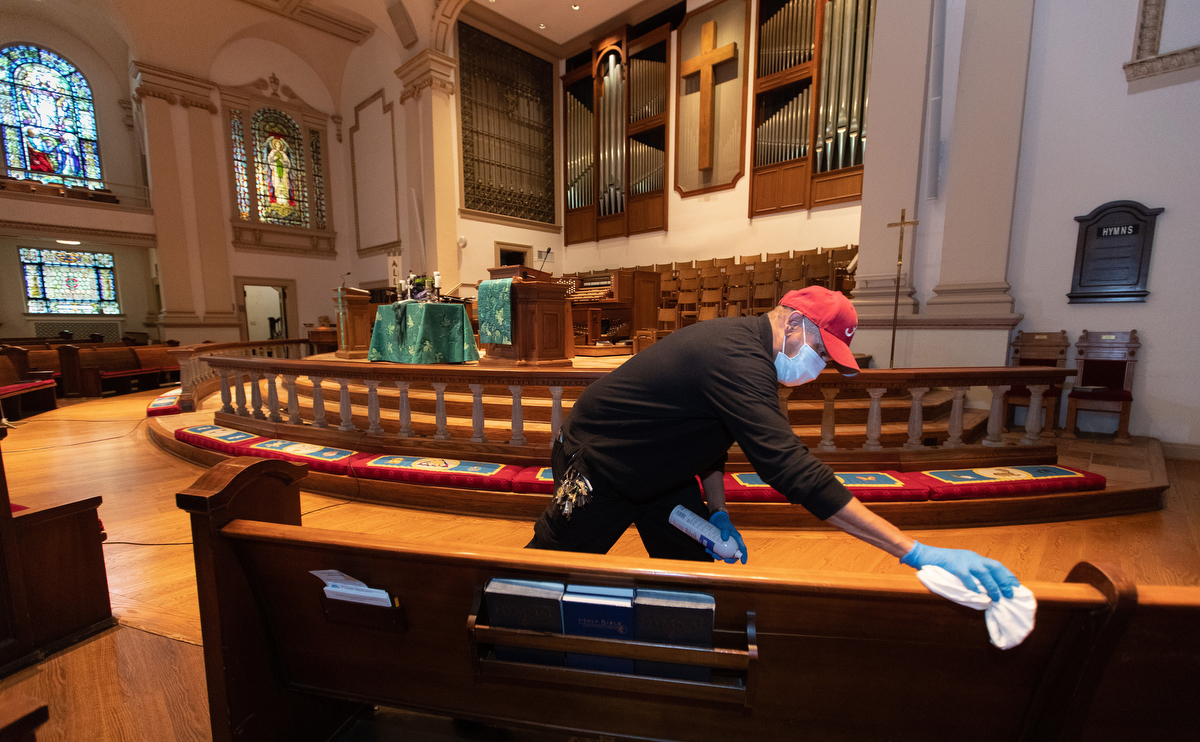 Custodian James Jimmerson disinfects pews to prevent any possible spread of the coronavirus at Belmont United Methodist Church in Nashville, Tenn. on Sunday, May 10, 2020, after online worship, which was recorded in the sanctuary. As churches consider returning to in-person worship, cleaning measures are one of many factors leaders will need to consider. “I believe my job, my part in this, is to make sure people are safe in here,” Jimmerson said. Photo by Mike DuBose, UM News. Custodian James Jimmerson disinfects pews to prevent any possible spread of the coronavirus at Belmont United Methodist Church in Nashville, Tenn. on Sunday, May 10, 2020, after online worship, which was recorded in the sanctuary. As churches consider returning to in-person worship, cleaning measures are one of many factors leaders will need to consider. “I believe my job, my part in this, is to make sure people are safe in here,” Jimmerson said. Photo by Mike DuBose, UM News.