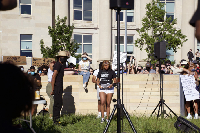 A woman speaks in Des Moines, Iowa, during protests around the U.S. against police brutality and the killing of African Americas like George Floyd. Photo by Kaitlyn E. Winders.