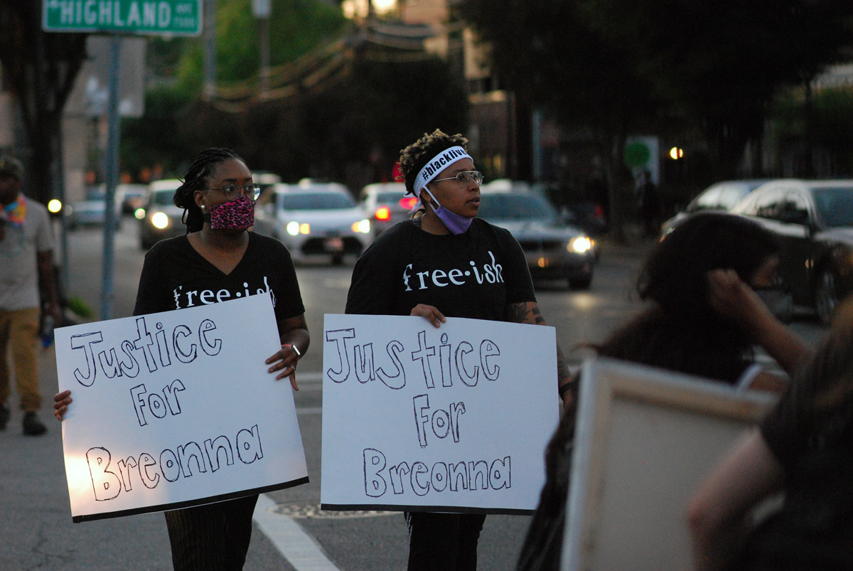 Two women march with signs calling for justice for Breonna Taylor, during protests in Louisville, Kentucky, over the police killings of Taylor in Louisville, George Floyd in Minneapolis, Minn., and other African Americans. Taylor, a 26-year-old emergency room technician, was shot eight times in her bed when officers broke down her door to serve a search warrant. Photo by Cathy Bruce, courtesy of the Kentucky Conference.