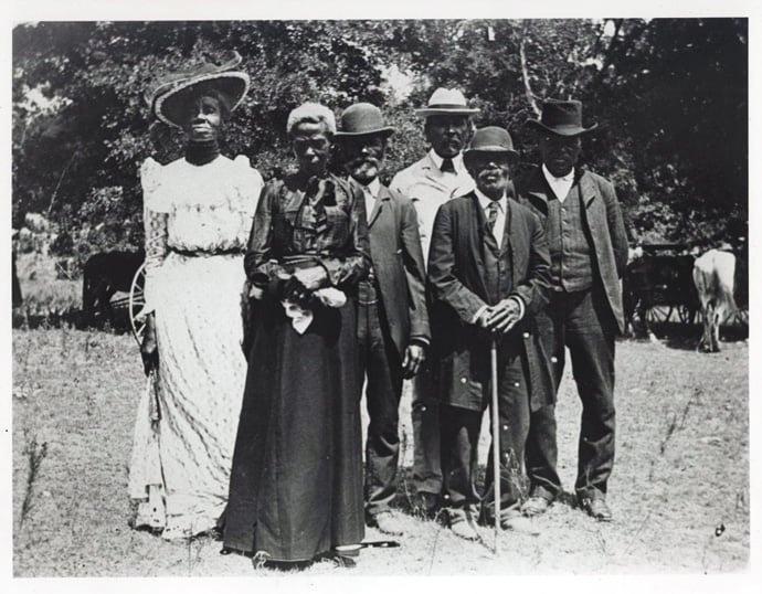 Historic image of a Juneteenth Emancipation Day Celebration, June 19, 1900, Texas, from The Portal to Texas History Austin History Center, Austin Public Library. Although the Emancipation Proclamation was issued more than two years prior, the holiday celebrates the reading of federal orders on June 19, 1865 in Galveston, Texas, one of the remote areas of slavery where enforcement had been slow and inconsistent. Photo by Mrs. Charles Stephenson (Grace Murray), courtesy of Wikimedia Commons.