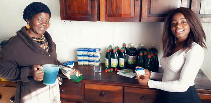 Seviria Taedza, 22, and her mother, Muidzo, fill bottles with dishwashing liquid and petroleum jelly at their home in Gweru, Zimbabwe. Taedza learned to make detergent at a girls’ empowerment workshop sponsored by The United Methodist Church in Zimbabwe. She markets her products under the names Sevsoft and Sevshine. Photo by Kudzai Chingwe, UM News.