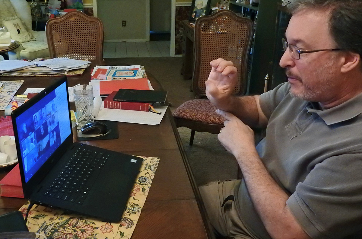 The Rev. Tom Hudspeth of Lovers Lane United Methodist Church leads a Wednesday night Zoom devotional and prayer gathering in American Sign Language. It’s one way that the Dallas church, which has a long history in Deaf ministries, has responded to the COVID-19 pandemic. Photo by Sam Hodges, UMNS.