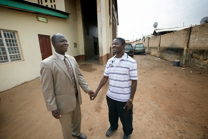 Dr. Martin Salia (right) visits with Bishop John K. Yambasu at the United Methodist Church's Kissy Hospital outside Freetown, Sierra Leone, in April 2014. The hospital was closed Nov. 11, 2014, after Salia, chief medical officer and surgeon, tested positive for Ebola. Salia died later that month of Ebola. File photo by Mike DuBose, UM News.