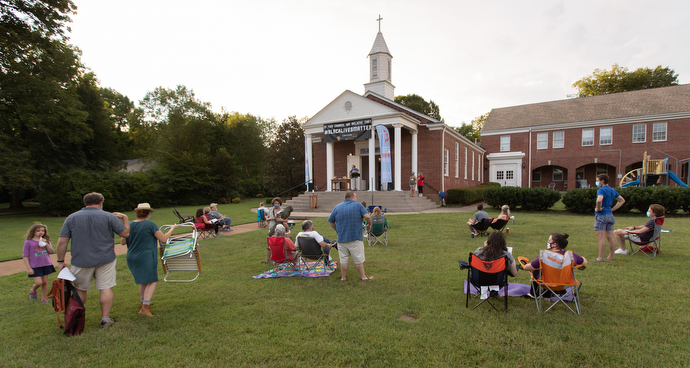 Parishioners gather on the lawn for an outdoor worship and communion service at Glendale United Methodist Church in Nashville, Tenn. Photo by Mike DuBose, UM News.