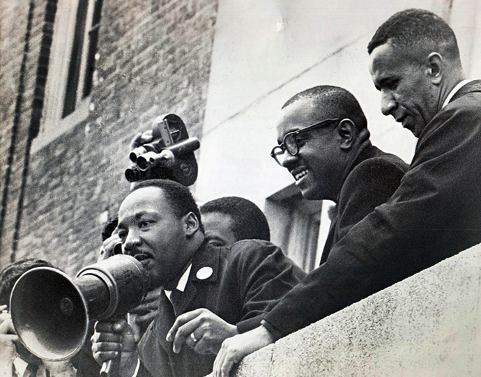 The Rev. Gil Caldwell (right) stands with the Revs. Martin Luther King Jr. (left) and Virgil Wood on the roof of a Boston public school in 1965. Photo courtesy of the Rev. Gilbert H. Caldwell.