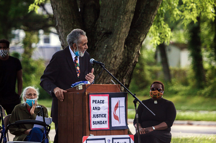 The Rev. Gil Caldwell stands up for Black Lives Matter at a peaceful rally, just months before he died. To Caldwell’s right is his wife of more than 60 years, Grace Caldwell. To Caldwell’s left is the Rev. Vanessa Wilson, chairperson of the Greater New Jersey Commission on Race and Religion and pastor of Good Shepherd United Methodist Church in Willingboro, N.J. File photo by Aaron Wilson Watson.