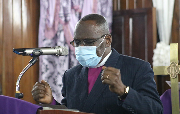 Bishop Benjamen Boni, Côte d'Ivoire, leads a moment of prayer during the Sept. 5 funeral vigil for Sierra Leone Area Bishop John K. Yambasu held at King Memorial United Methodist Church in Freetown, Sierra Leone.  Photo by E Julu Swen, UM News.