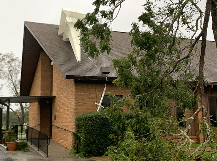 The steeple at Lillian (Ala.) United Methodist Church dangles from its mounting after Hurricane Sally. Photo courtesy of the Rev. Daniel Randall.