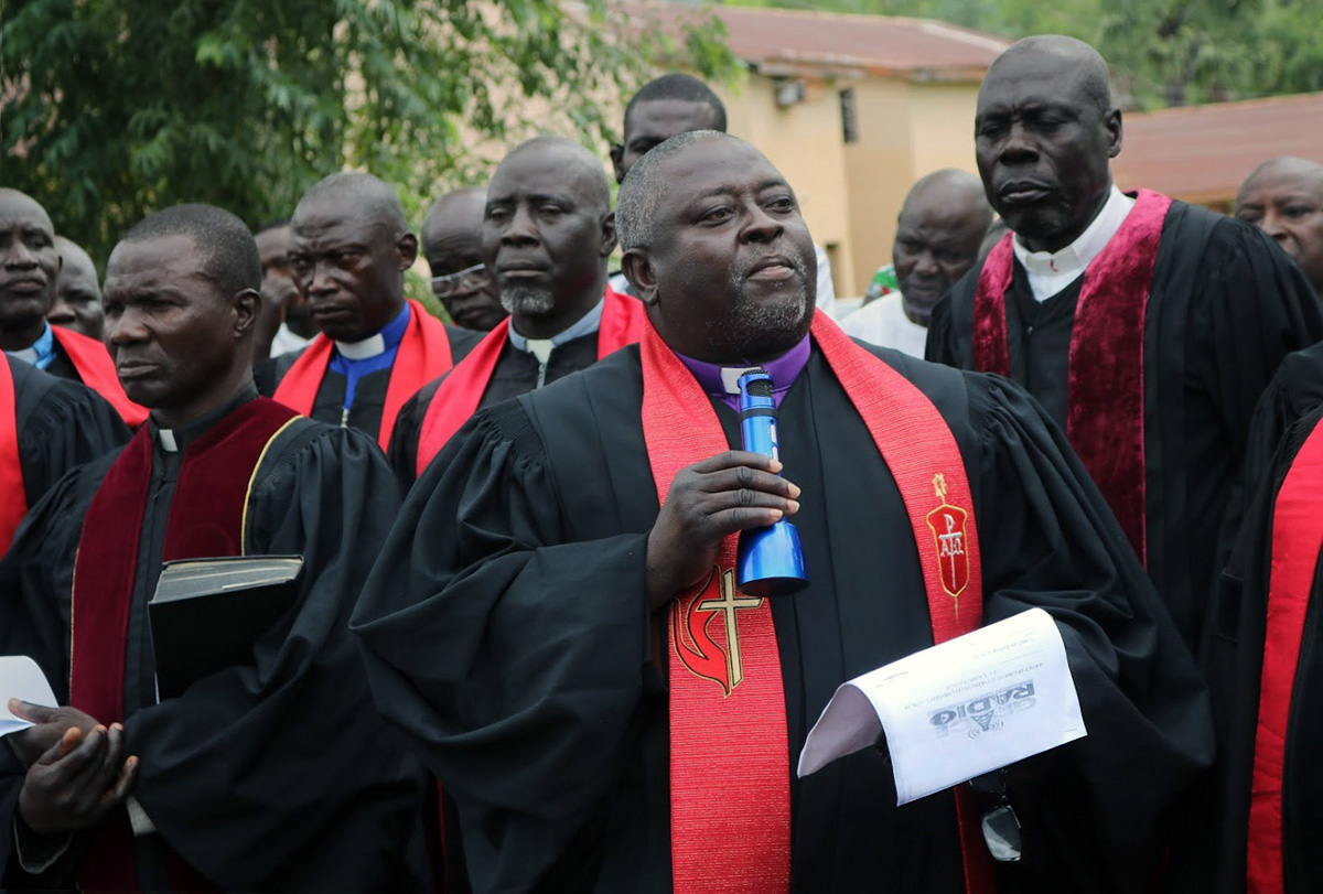 Nigeria Area Bishop John Wesley Yohanna (center front) addresses the press during the groundbreaking ceremony for a new United Methodist radio station in Jalingo, Nigeria. Grace Radio will be the first faith-based station in the Northeast region. Photo by the Rev. Ande I. Emmanuel, UM News.