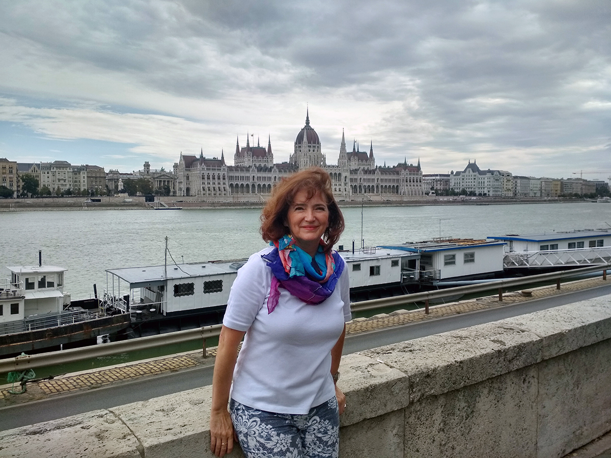 Györgyi Vályi followed the call to lead a small church in Budapest, Hungary, called Hope Church. Her ministry as a mission worker leading the church has come amid the COVID-19 pandemic. Portrait taken in front of the Parliament building by the Danube River. Photo courtesy of Györgyi Valyi.