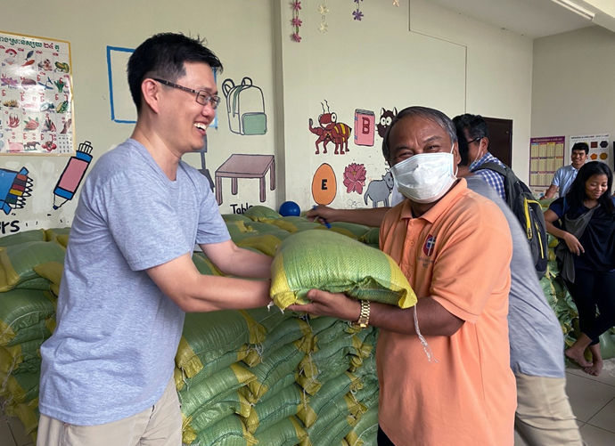 The Rev. Andrew Lee (left) has witnessed hardships related to the coronavirus while serving as a missionary in Cambodia, especially for the poor and marginalized. Lee has helped distribute a 10 kilogram-sack of rice, soaps, reusable masks and sanitize to those suffering hardship during the COVID pandemic. Photo courtesy of the Rev. Andrew Lee.