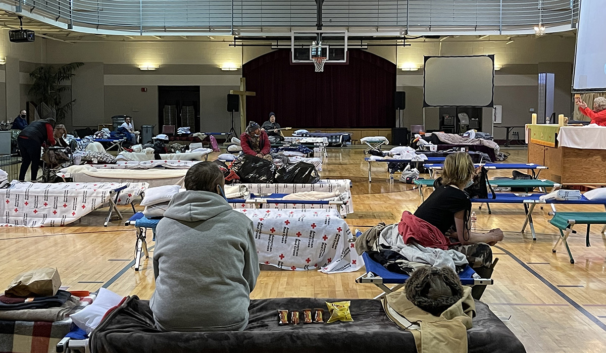 People seeking shelter from snow and bitter cold are offered Holy Communion in the gymnasium at First United Methodist Church in Hot Springs, Ark. The church is operating the warming shelter in cooperation with the local Red Cross. Photo by Cindy English. People seeking shelter from snow and bitter cold are offered Holy Communion in the gymnasium at First United Methodist Church in Hot Springs, Ark. The church is operating the warming shelter in cooperation with the local Red Cross. Photo by Cindy English.