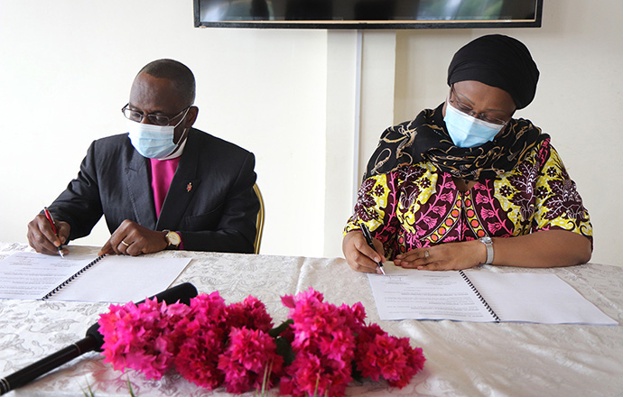 Bishop Benjamin Boni (left) and Lydie Flore Magba, Central African Republic ambassador to Côte d’Ivoire, initial the framework for cooperation in education between The United Methodist Church in Côte d’Ivoire and the Central African Republic in October, 2020. The collaboration aims to revitalize the Central African education system, which has been disorganized by years of successive socio-political and economic crises. File photo by Isaac Broune, UM News.