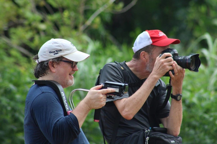 Journalists, Joey Butler and Mike DuBose, shoot video and still photos for the Global Voices, News and Information Department at United Methodist Communications. They were working on a package highlighting various ministries of the United Methodist Church in Liberia. Photo by E Julu Swen, UM News.