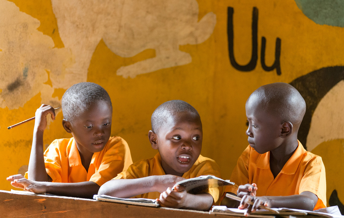 Students work together on spelling words in the combined kindergarten and first grade classroom at the Bishop Judith Craig Children's Village in Duahzon, Liberia. 2017 file photo by Mike DuBose, UM News.