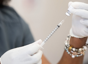 Tia Moore, a nurse practitioner, prepares a dose of the Pfizer COVID-19 vaccine at Meharry Medical College in Nashville, Tenn. Photo by Mike DuBose, UM News.