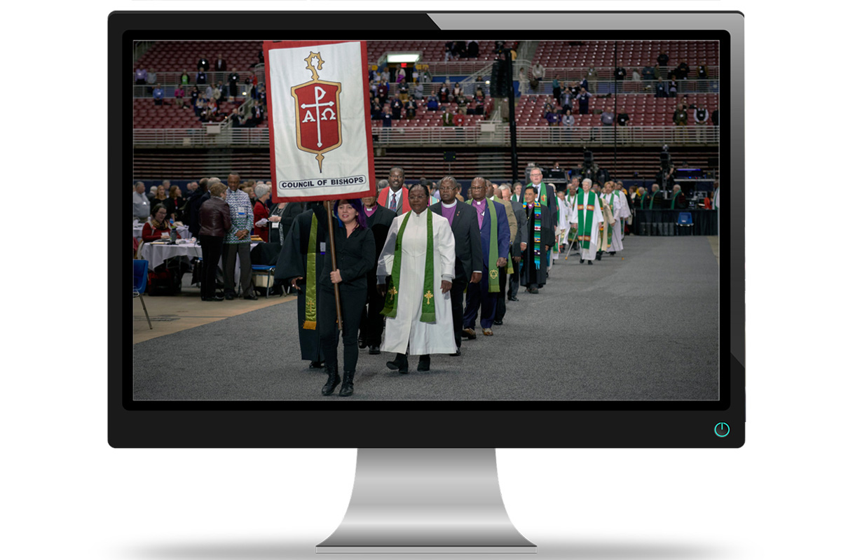 Bishops process into worship on Feb. 24, 2019, at the special session of General Conference, held in St. Louis. A group of delegates is urging bishops to rethink their plans for a special virtual General Conference on May 8 and a hold on U.S. bishop elections this year. File photo by Paul Jeffrey, UM News; computer image by Michael Gaida, courtesy of Pixabay. Bishops process into worship on Feb. 24, 2019, at the special session of General Conference, held in St. Louis. A group of delegates is urging bishops to rethink their plans for a special virtual General Conference on May 8 and a hold on U.S. bishop elections this year. File photo by Paul Jeffrey, UM News; computer image by Michael Gaida, courtesy of Pixabay.