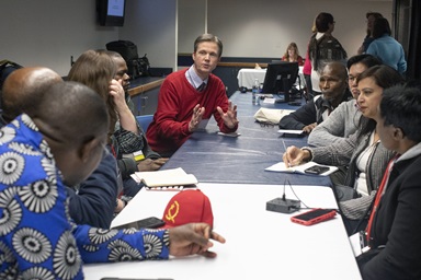 Tim Tanton (center, in red), chief news and information officer for United Methodist Communications, shares updates with African communicators and other UMCom staff during the 2019 General Conference. World Press Freedom Day, observed May 3, commemorates journalists and highlights the difficulties they face while reporting truth. File photo by Kathleen Barry, UM News Tim Tanton (center, in red), chief news and information officer for United Methodist Communications, shares updates with African communicators and other UMCom staff during the 2019 General Conference. World Press Freedom Day, observed May 3, commemorates journalists and highlights the difficulties they face while reporting truth. File photo by Kathleen Barry, UM News