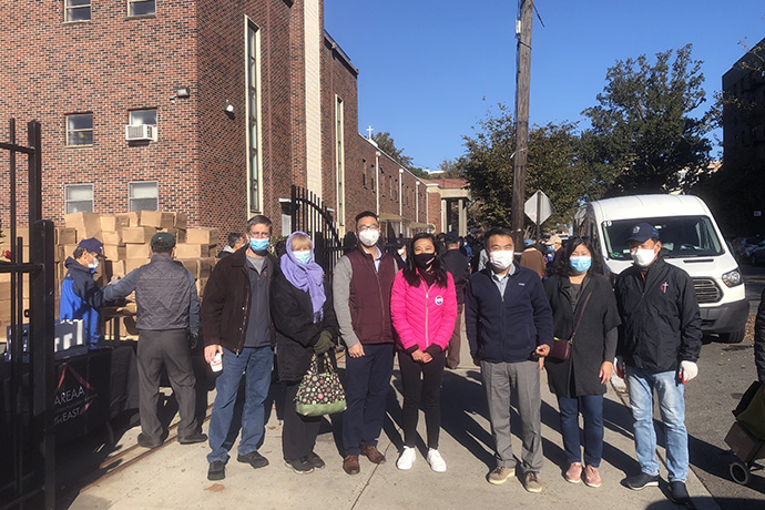 Volunteers with a United Methodist food pantry team gather for a group photo at First United Methodist Church in Flushing, N.Y. From left are: the Rev. Tom Vencuss, director for Missions and Disaster Response in the New York Conference; Wendy Vencuss, conference abundant health coordinator; two members of the Asian Real Estate Association of America; the Rev. Chongho Kim, pastor of First United Methodist Church in Flushing; U.S. Rep. Grace Meng; and Yonghwa Ha, mission committee chairperson at First United Methodist Church in Flushing. Photo by the Rev. Thomas Kim, UM News.