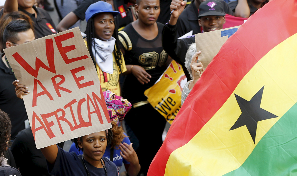 Demonstrators carry placards during a march against xenophobia in Johannesburg in 2015. Xenophobia — fear or hatred of strangers or foreigners — continues to be widespread in South Africa, where harassment and violence against African and Asian non-nationals are routine and sometimes lethal, according to Human Rights Watch. File photo by Mike Hutchings, Reuters.