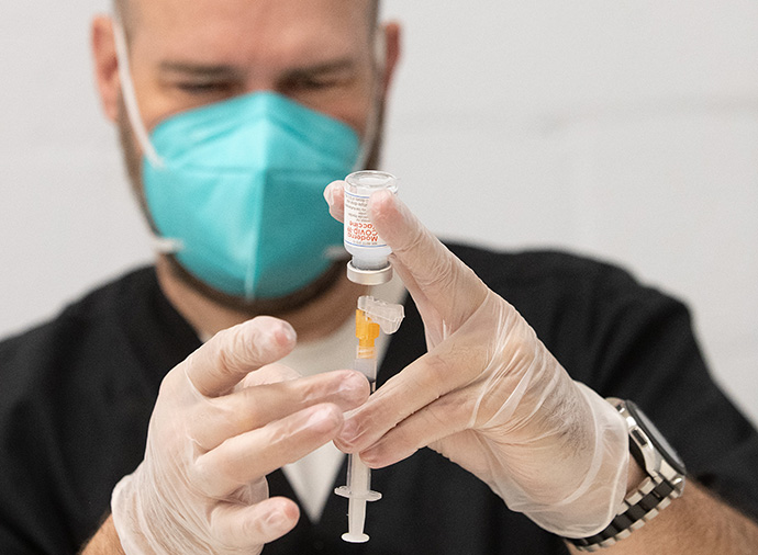 Carl Wood draws a dose of the Moderna COVID-19 vaccine during a clinic at St. Mark’s United Methodist Church in Charlotte, N.C., in April. Wood said that faith leaders getting vaccinated themselves sets an example: “If church leadership takes their shots, someone can say, ‘I can feel safe, too.’” File photo by Mike DuBose, UM News.