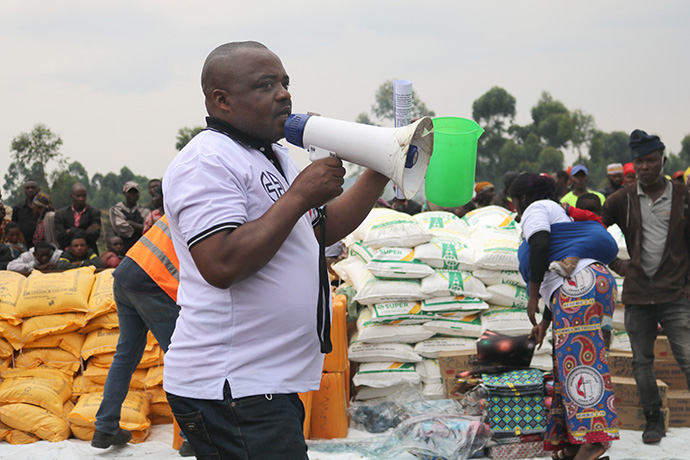 Volunteer Zacky Kabunga explains the process for the distribution of relief supplies in Kabati, Congo. Photo by Philippe Kituka Lolonga, UM News.