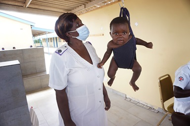 Emilia Benhilda Marembo weighs a baby at the Dindi United Methodist Clinic in Murewa, Zimbabwe. The rural clinic is an outreach of Nyadire United Methodist Hospital  Photo by Kudzai Chingwe, UM News.  Emilia Benhilda Marembo weighs a baby at the Dindi United Methodist Clinic in Murewa, Zimbabwe. The rural clinic is an outreach of Nyadire United Methodist Hospital  Photo by Kudzai Chingwe, UM News.