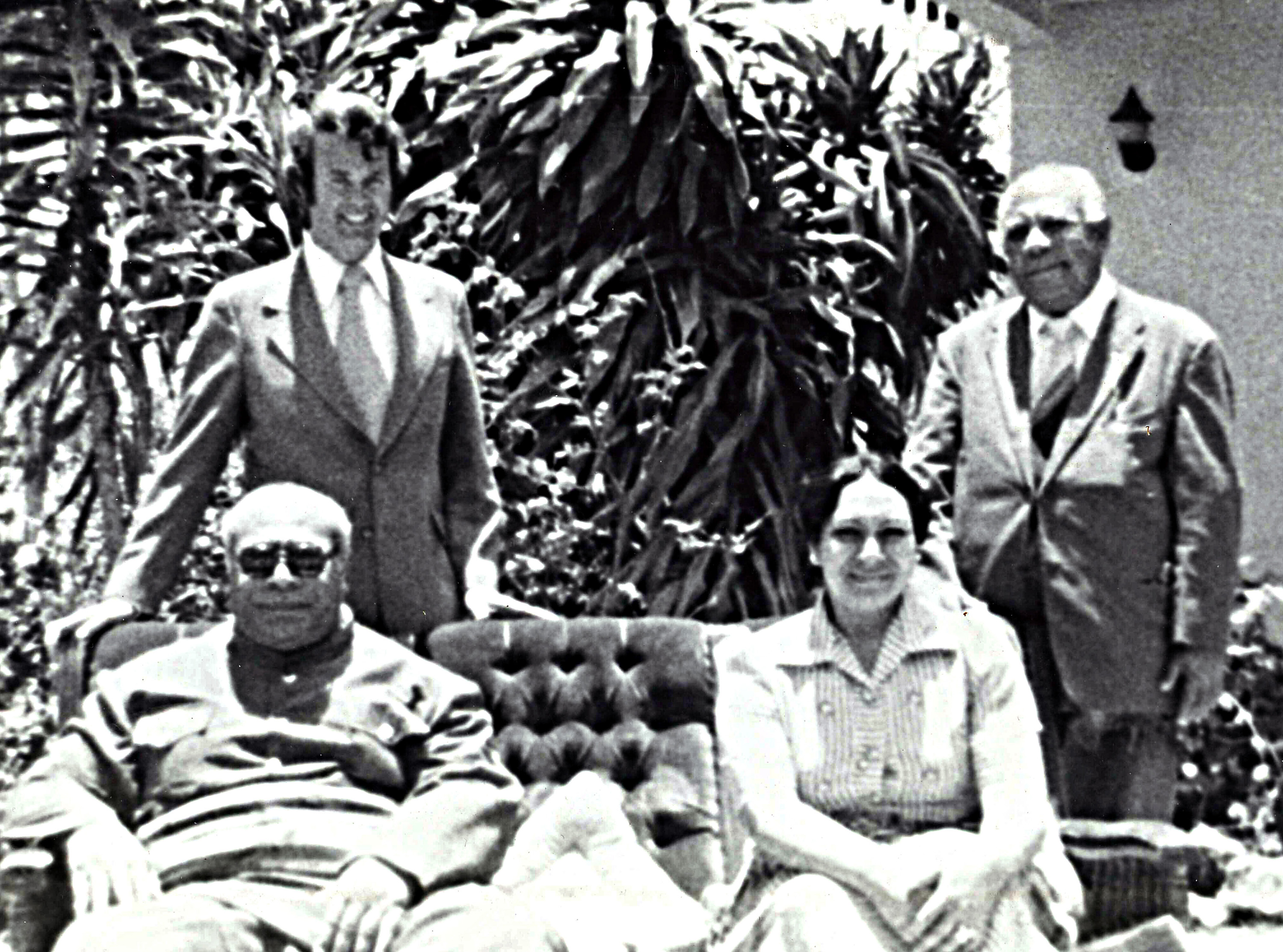 The Rev. H. Eddie Fox (left, rear) poses with King Tāufaʻāhau Tupou IV and Queen Halaevalu Mataʻaho ʻAhomeʻe of Tonga (seated) in 1975. Photo courtesy of the Rev. H. Eddie Fox.