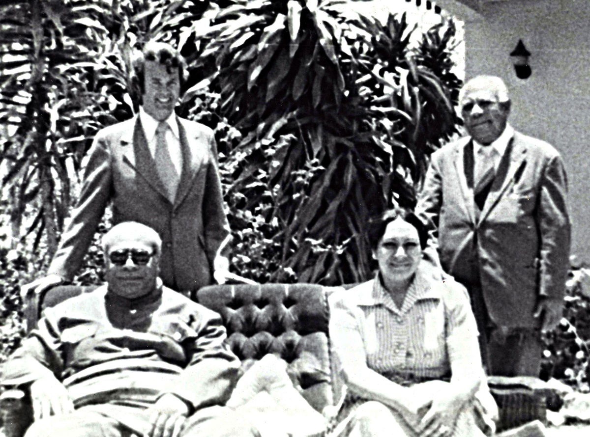 The Rev. H. Eddie Fox (left, rear) poses with King Tāufaʻāhau Tupou IV and Queen Halaevalu Mataʻaho ʻAhomeʻe of Tonga (seated) in 1975. Photo courtesy of the Rev. H. Eddie Fox.