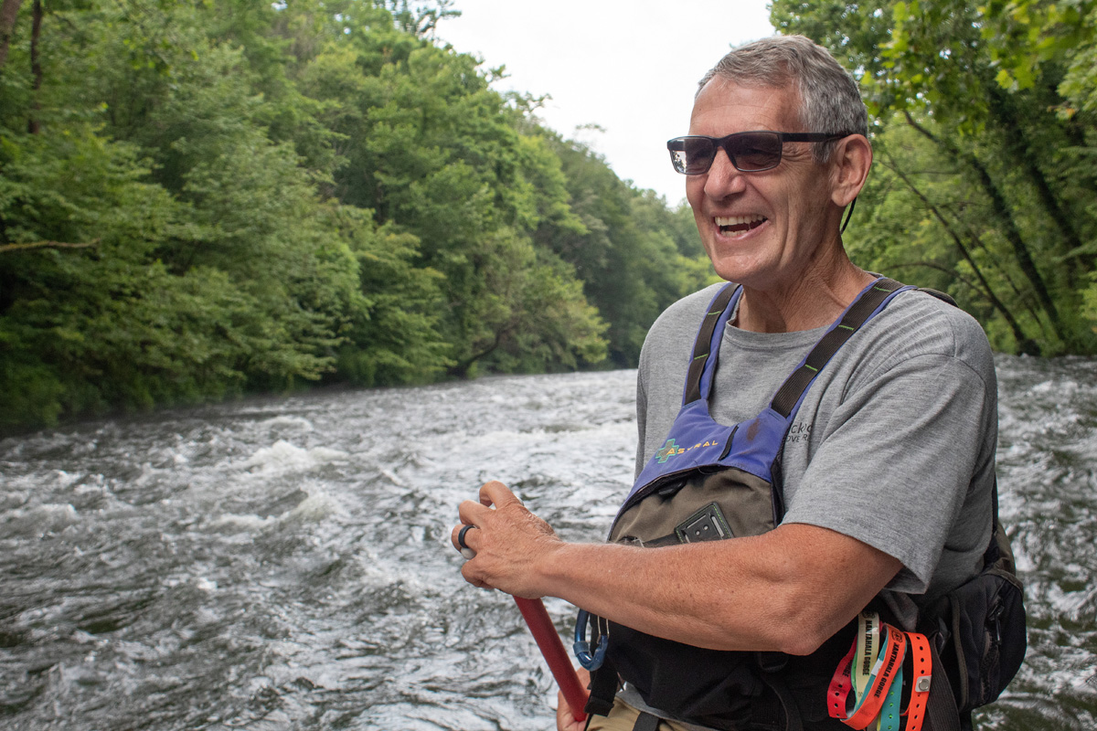 The Rev. Wayne Dickert guides a raft down the Nantahala River near Bryson City, N.C. A 1996 U.S. Olympic kayaker and pastor of Bryson City United Methodist Church, Dickert has conducted riverside services beside the Nantahala for the past 15 years. Photo by Mike DuBose, UM News.
