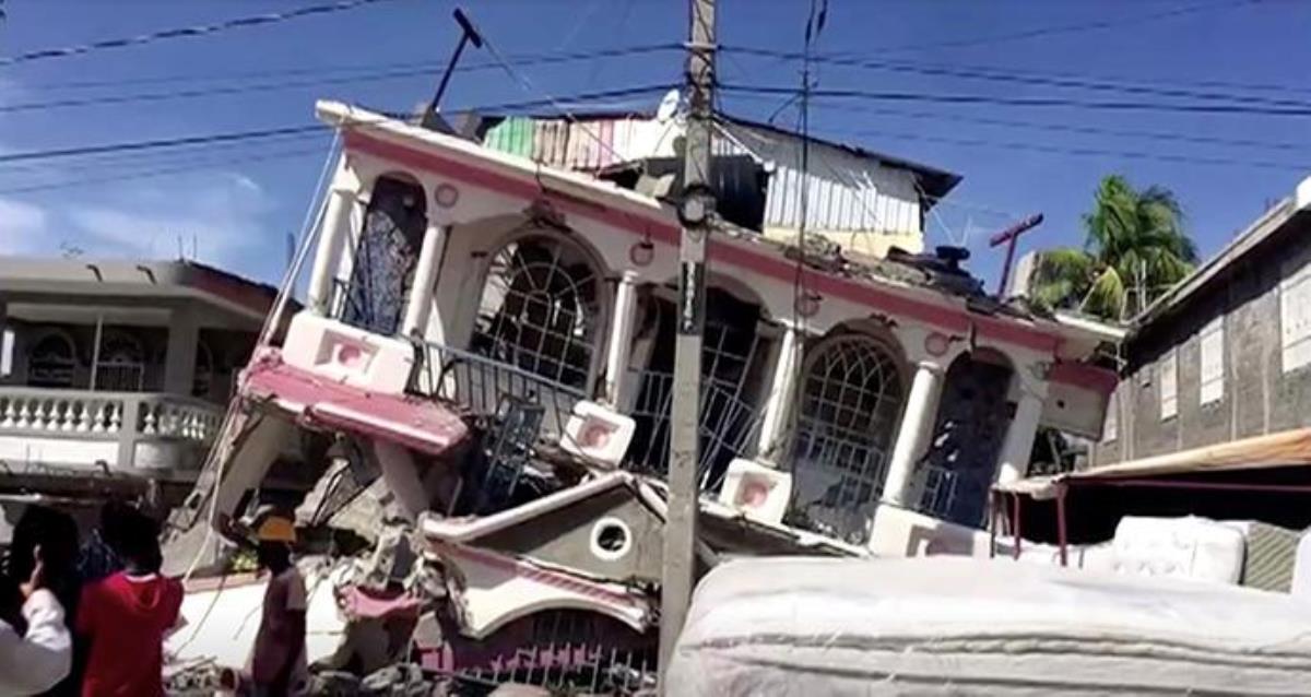 A view of a collapsed building following an earthquake in Les Cayes, Haiti, seen in this still image taken from a video obtained by Reuters on Aug. 14, 2021. United Methodists are working with longtime partners in Haiti to respond after the 7.2-magnitude earthquake and as a major storm approaches. REUTERS TV via REUTERS.