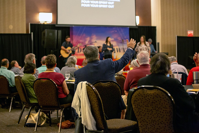 Conference voters join in worship during the Aug. 13-14 Northwest Texas Annual Conference at the Overton Hotel in Lubbock, Texas. During the meeting, the voters overwhelmingly passed an aspirational resolution signaling that the conference would join a new traditional Methodist denomination under a proposed plan of separation. Photo courtesy of the Northwest Texas Conference.