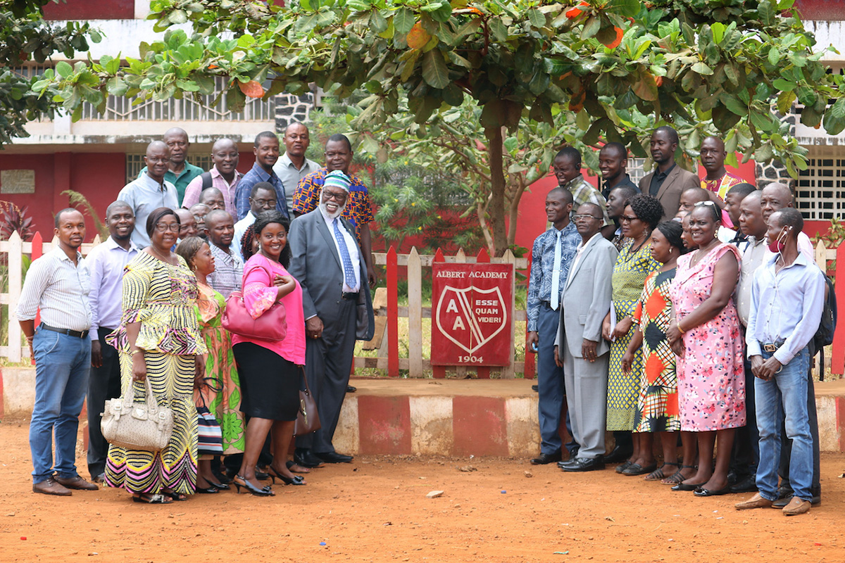 United Methodist Bishop Warner Brown (to the left of sign, middle row) poses with staff of the Albert Academy boys’ high school in Freetown, Sierra Leone, during a familiarization tour of United Methodist institutions in the country. Brown was appointed as interim bishop of the Sierra Leone Episcopal Area following the death of Bishop John K. Yambasu in 2020. Photo by Phileas Jusu, UM News. 