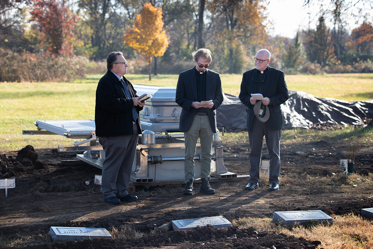 United Methodist clergy conduct a graveside funeral service for Frederick Harris at Hills of Calvary Memorial Park in Nashville, Tenn., as part of the Call the Name program. The volunteer program, started by the Rev. Jay Voorhees (left), provides clergy to acknowledge deceased people who haven’t been claimed by anyone, making sure that their name is said aloud one last time and offering a short ritual of committal in their honor. Voorhees is joined by the Revs. Luke Lea (center) and James Cole (right). Photo by Mike DuBose, UM News.