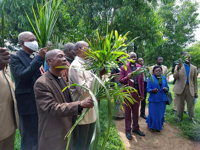 United Methodist pastors in eastern Congo celebrate the election of Bishop Gabriel Yemba Unda as provincial president of the Church of Christ in Congo in Maniema upon his arrival at the episcopal office at Lokole Mission. Photo by Judith Osongo, UM News.