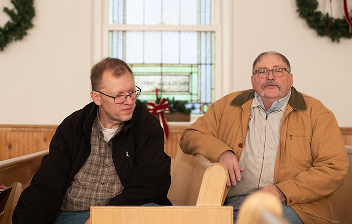 The Rev. Dennis Vance Jr. (left) and Tony Hudson discuss the work of the Graves County (Ky.) Community Emergency Response Team in responding to the deadly tornadoes that tore through the area in December 2021. Vance is pastor of St. Paul United Methodist Church in Wingo, Ky., and Hudson is one of the church’s lay leaders. Photo by Mike Dubose, UM News.