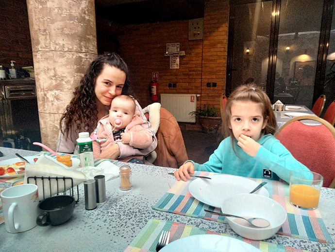 A mother who fled Ukraine with her two children takes shelter at the United Methodist community center in Cluj-Napoca, Romania. Photo courtesy of Urs Schweizer. 