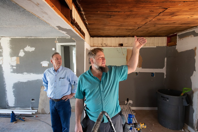 Peter L. Yoder (right) talks with Bill Howell about the progress of repairs to a home that was damaged by repeated natural disasters in Lake Charles. Yoder was supervising a volunteer team from the Amish community in Ohio that is part of a new disaster relief coalition. Howell Howell helps manage disaster response for the Louisiana Conference of The United Methodist Church. Photo by Mike DuBose, UM News.