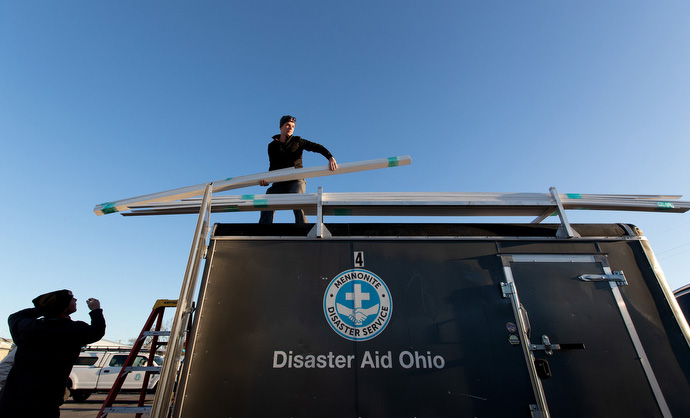 Allen Erb loads trim boards on a Mennonite Disaster Aid trailer at University United Methodist Church in Lake Charles. Erb was part of an Amish and Mennonite volunteer team staying at the church while they repair homes damaged by natural disasters. Photo by Mike DuBose, UM News.