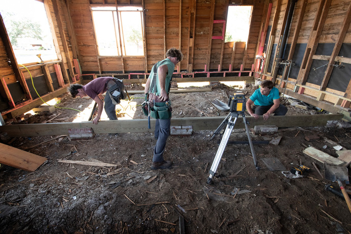 Amish volunteers from Ohio set new joists to level the floor of a storm-damaged home in Lake Charles. Photo by Mike DuBose, UM News.