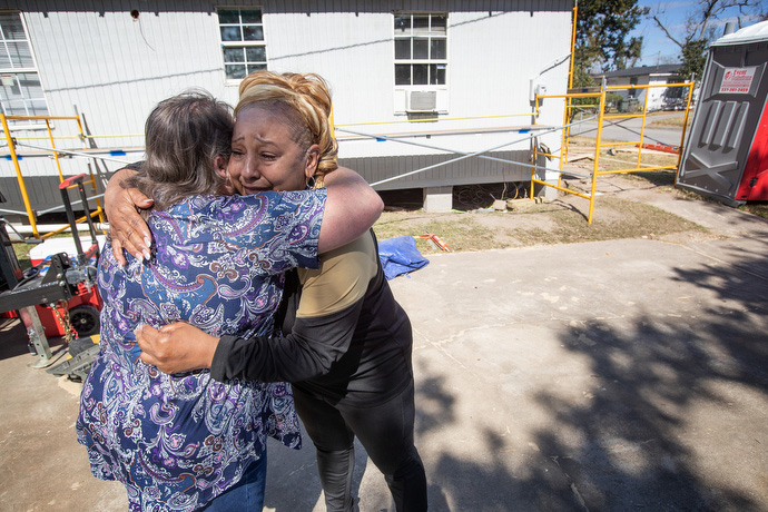 Katherine Howell (left) embraces Debra Duhon outside Duhon’s home, which is being repaired by volunteers, in Lake Charles. Howell is a United Methodist Mission Volunteer and is married to Bill Howell, who helps manage disaster response for the Louisiana Conference of The United Methodist Church. Photo by Mike DuBose, UM News.