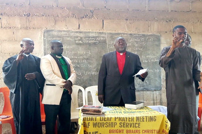 Nigeria Bishop John Wesley Yohanna (behind table) inaugurates the new church. The new congregation has 30 members. Photo by Ezekiel Ibrahim, UM News.