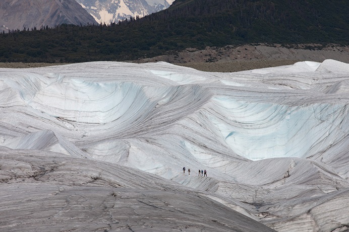 Hikers make their way across Kennicott Glacier near McCarthy, Alaska, in 2021. Scientists say glaciers worldwide are projected to lose anywhere from 18% to 36% of their mass by 2100, resulting in almost 10 inches of sea level rise. Photo by Mike DuBose, UM News. Hikers make their way across Kennicott Glacier near McCarthy, Alaska, in 2021. Scientists say glaciers worldwide are projected to lose anywhere from 18% to 36% of their mass by 2100, resulting in almost 10 inches of sea level rise. Photo by Mike DuBose, UM News.