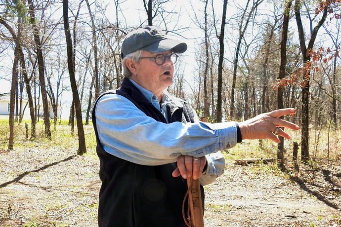 Tom Locke likes to walk the wooded acreage he owns near Honey Grove, Texas, where he spent weekends and summers as a boy, helping tend the family land. Locke has announced his retirement as president of the Texas Methodist Foundation. He’s led the organization for nearly 30 years, and in recent years also has been president of Wesleyan Investive. Photo by Sam Hodges, UM News.
